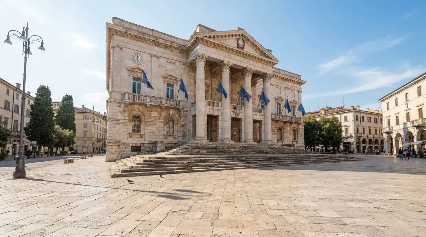 Palazzo istituzionale con bandiere al vento in una piazza soleggiata — 50 free spins senza deposito