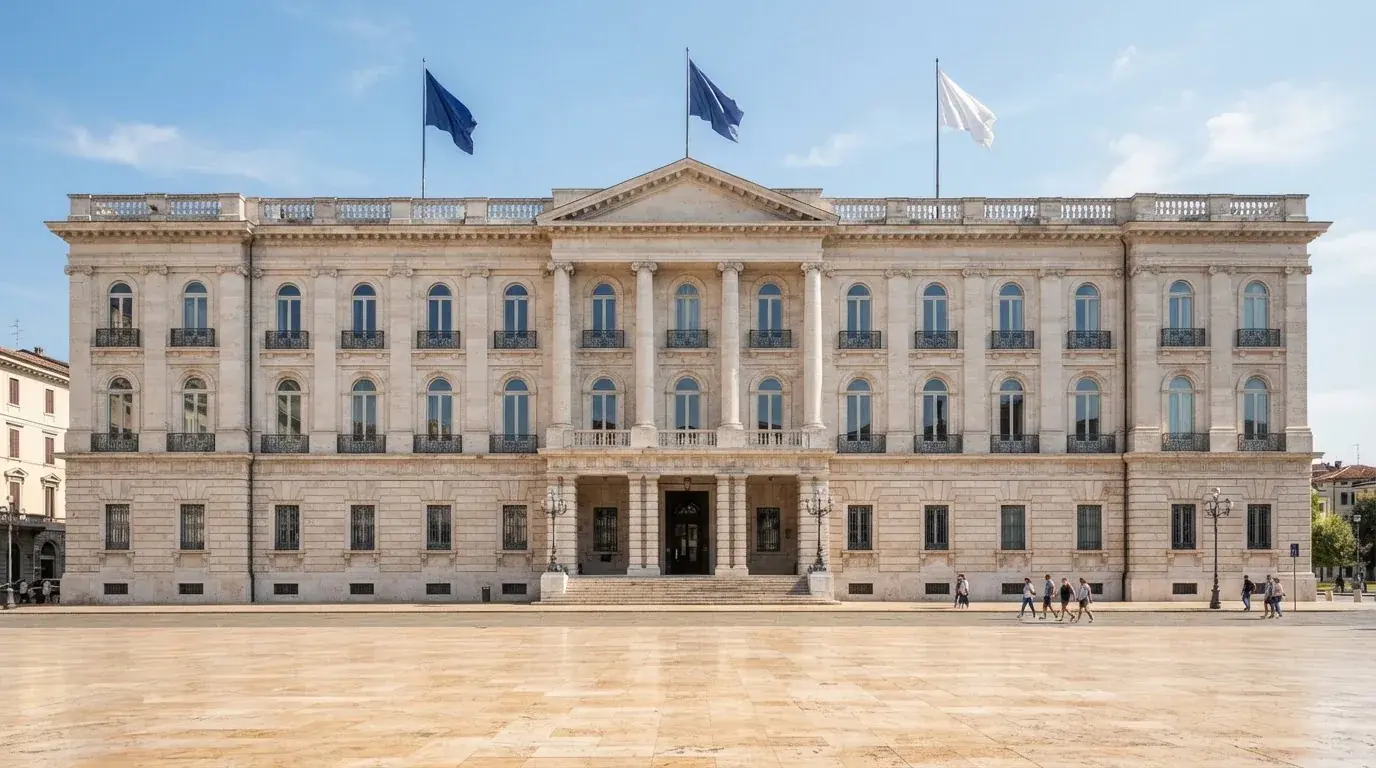 Palazzo istituzionale con bandiere al vento in una piazza soleggiata — casino deposito minimo 1 euro